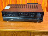 Front three-quarter view showing entire receiver exterior, controls and vents