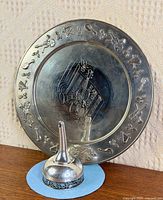 Platter and funnel together showing overall design, scale