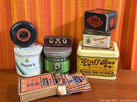 Group shot of all tins and mantle boxes