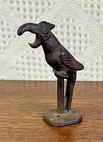 Front view of cast iron parrot bottle opener
