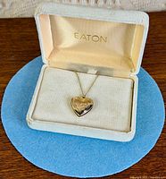 Closed Eaton box showing locket necklace inside