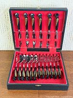 full cutlery set displayed in open case