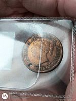 Obverse showing Queen Victoria portrait, hole visible