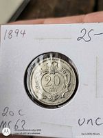 reverse side showing 20 and 1894 within ornate design