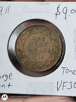 Reverse of 1911 Canada one cent showing ONE CENT CANADA 1911 within wreath