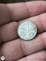 Reverse of 1922 Canadian 5-cent coin showing denomination and date