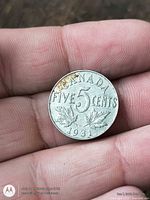 Reverse showing CANADA FIVE CENTS 1931 with maple leaves