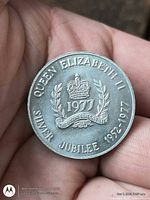 Obverse of coin showing crown, wreath, date and legend