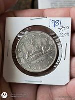 Reverse of 1981 Canada dollar in flip