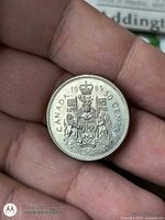 Reverse showing Canadian Coat of Arms and date