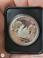 Reverse of 1989 Canadian proof silver dollar showing Mackenzie River design