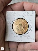 Reverse side of 1995 Canada $1 loonie showing peacekeeping design in 2×2 holder