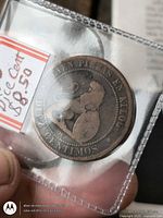 Obverse showing legends and seated figure