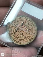 Obverse side showing coat of arms and text ROYAL ARCH MASONS OF CANADA IN ONTARIO