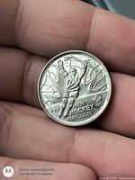 Reverse side showing men's ice hockey design with Olympic rings and year 2009