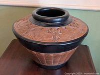 Overall view of redware pot showing incised design and black bands