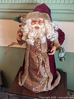 Full view of 24" Santa Claus figure standing on table