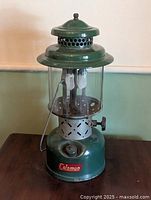 Full view of Coleman model 220E lantern showing tank, globe and ventilator