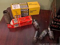 Boxed GE 6HG5 tube, boxed Vania EA05A tube, grey tube shield, three loose tubes on table