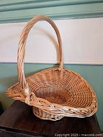 Full view of wicker basket showing handle and interior