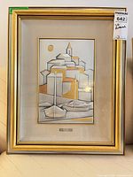 Full view of framed artwork inside gold frame