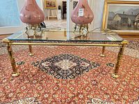 Full view of coffee table front on rug