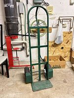 Front view of green steel hand truck dolly