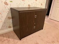 Front view showing two drawers and metal pulls