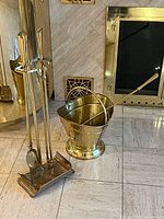 Tool set on stand next to brass bucket