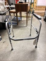 Full front view of folding toilet safety frame