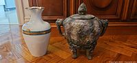 Limoges vase beside clay urn, full view