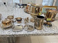 All silver-plated pieces grouped on table