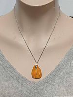 Necklace on mannequin frontal view showing pendant size and chain length