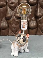 Full view of bulldog astronaut lamp with bulb installed
