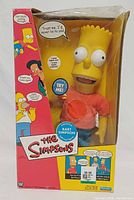 Front view of boxed Bart Simpson interactive figure showing window and graphics