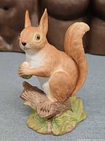 Front left view of Aynsley porcelain red squirrel figurine