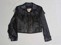 Front view of black leather fringe jacket