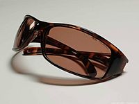 Side perspective of Bolle tortoise sunglasses showing frame shape and lens tint