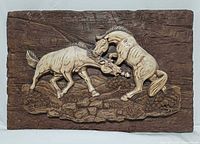 Front view of rectangular horse relief sculpture