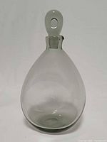 Front view of smoke gray Holmegaard York decanter with stopper