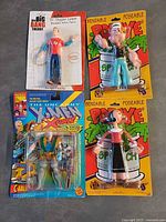 Front view of all four sealed action figures