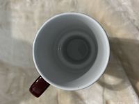 Top view of interior of burgundy ceramic mug