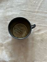 Top view showing interior and engraving at base