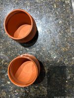 Top view of both clay wine cups showing interior and rim