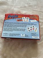 Back of Duple box detailing contents and gameplay