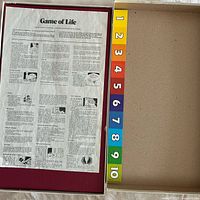 Box interior lid with printed instructions and numbered tray