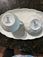 bottom marks of pitcher and bowl showing Kaiser hallmark