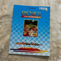 Front cover showing title Picnics and Barbecues and publisher mark