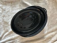 Pan assembled with lid on, showing exterior finish