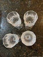 Top view of the four cut crystal wine glasses showing faceted rim pattern